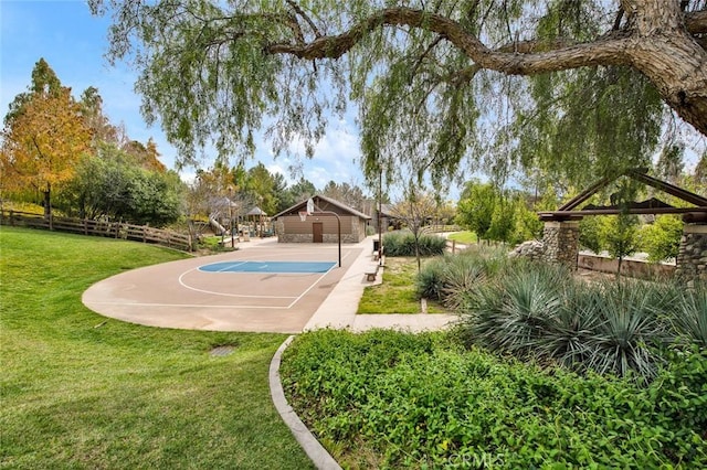 view of sport court featuring a gazebo, a yard, community basketball court, and fence
