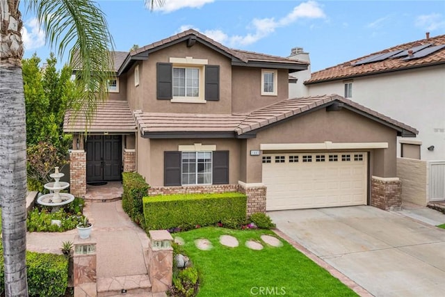 view of front of property featuring a tiled roof, a garage, stucco siding, and driveway