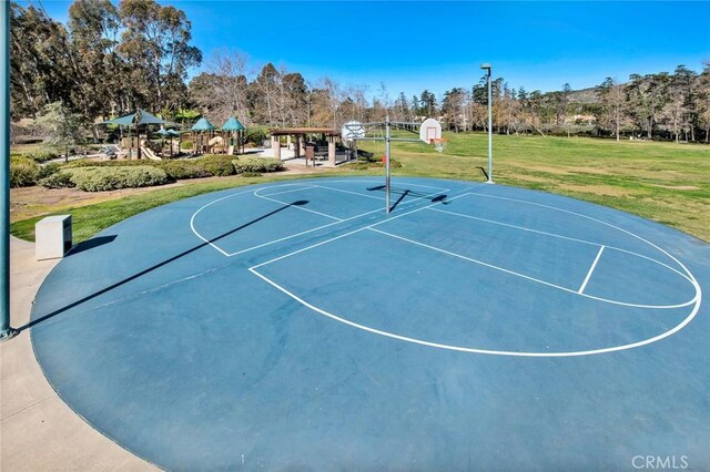 view of basketball court featuring a yard, playground community, and community basketball court