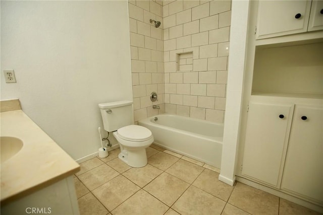 full bathroom featuring tile patterned floors, vanity, baseboards, toilet, and shower / bathtub combination