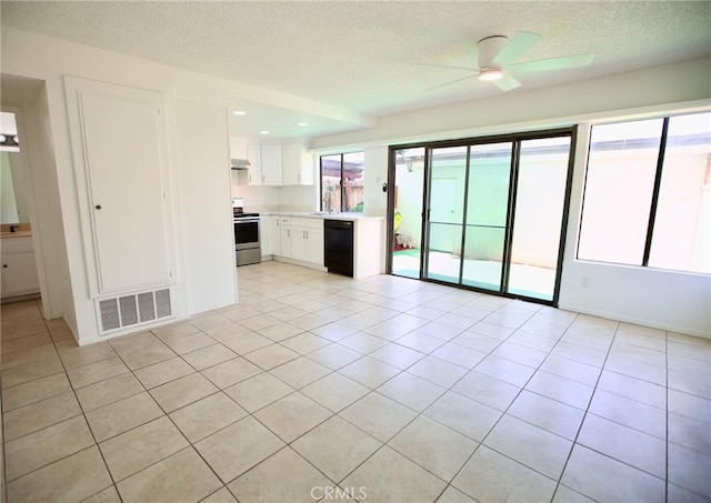 unfurnished living room featuring a textured ceiling, visible vents, ceiling fan, and a sink