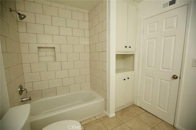 full bath featuring tub / shower combination, toilet, tile patterned floors, and visible vents