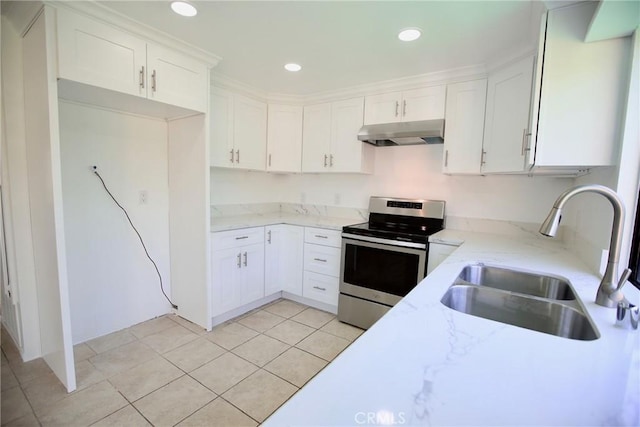 kitchen with under cabinet range hood, light stone countertops, stainless steel electric range, and a sink