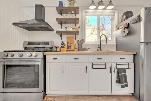 346 San Bernardino Ave, Sugarloaf, CA 92386 - kitchen with appliances with stainless steel finishes, a sink, white cabinetry, and exhaust hood