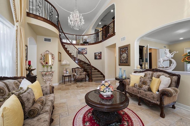 2831 Shenandoah Dr, Chula Vista, CA 91914 - living area with stone tile flooring, baseboards, ornamental molding, a towering ceiling, and a chandelier