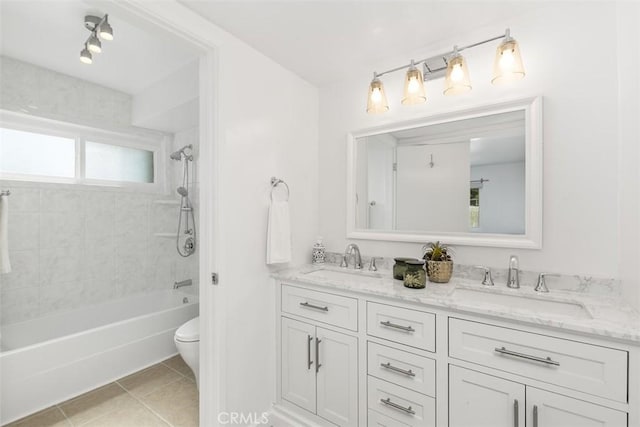 full bathroom featuring tile patterned floors, a sink, double vanity, and toilet