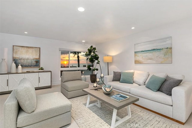 living room with recessed lighting and baseboards