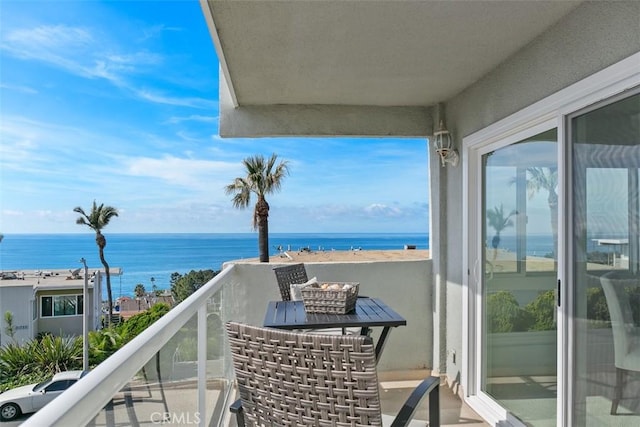 balcony featuring a water view