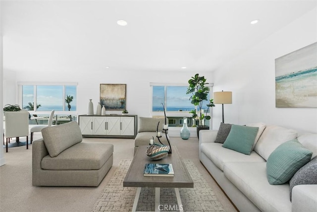 living room with light carpet, a healthy amount of sunlight, and recessed lighting