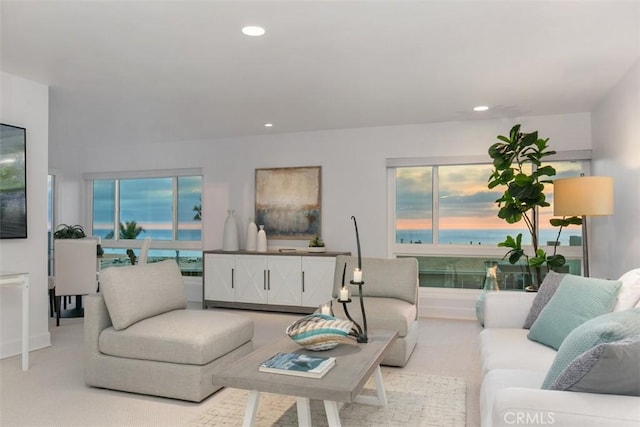 living room featuring light carpet and recessed lighting