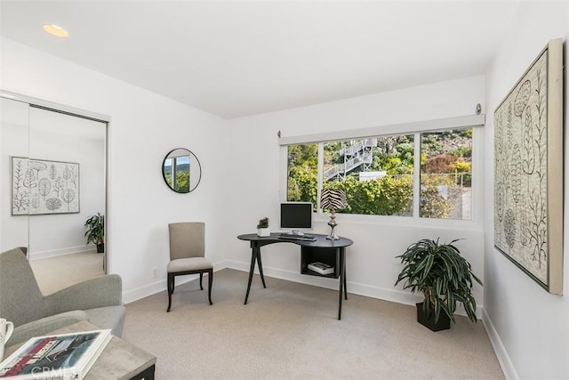 office area with baseboards and light colored carpet