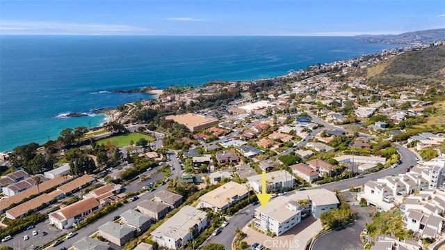 birds eye view of property featuring a water view and a residential view