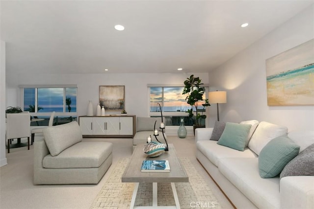 carpeted living area with recessed lighting
