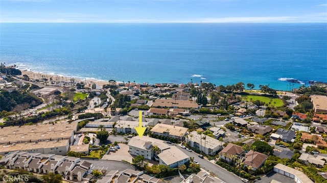 drone / aerial view with a water view and a residential view