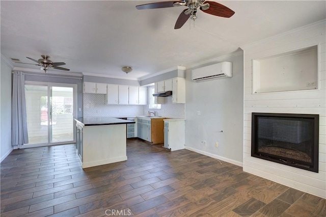 8920 Arcade Rd, Atascadero, CA 93422 - kitchen featuring a wall mounted AC, a ceiling fan, crown molding, and healthy amount of natural light