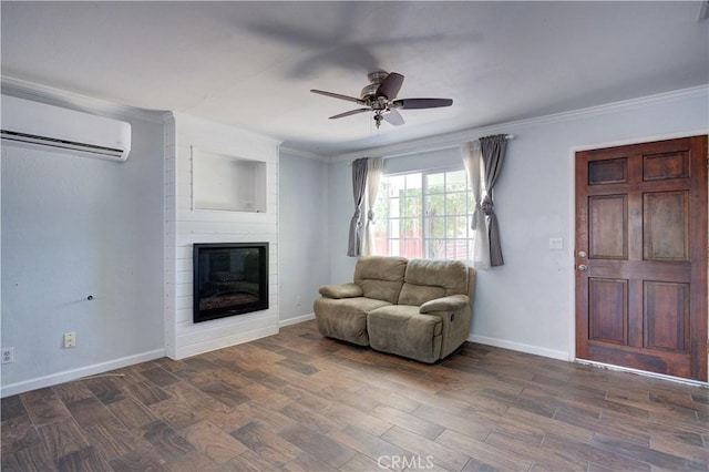 8920 Arcade Rd, Atascadero, CA 93422 - living room with a wall unit AC, ceiling fan, a large fireplace, crown molding, and dark wood-style flooring