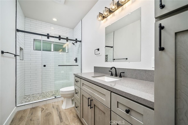 19000 Shakespeare Dr, Walnut, CA 91789 - bathroom with a shower stall, toilet, vanity, and wood finished floors