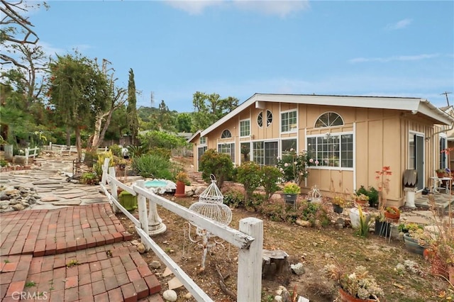 view of home's exterior featuring board and batten siding and a patio area