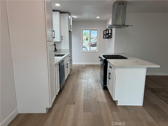 1333 Lancewood Ave, Hacienda Heights, CA 91745 - kitchen featuring wall chimney exhaust hood, range with gas stovetop, stainless steel dishwasher, wood finished floors, and light stone countertops