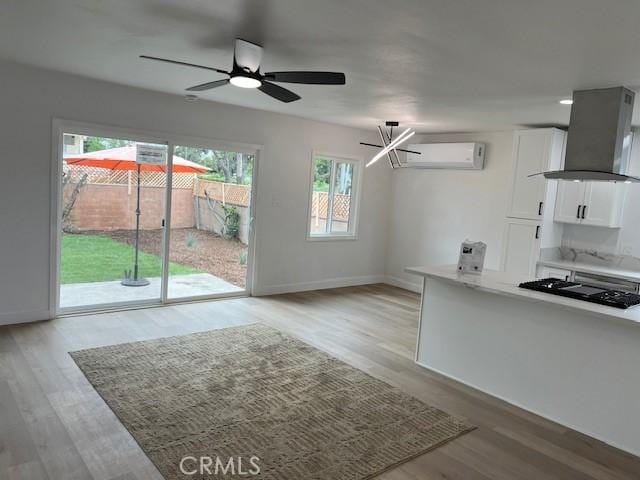 1333 Lancewood Ave, Hacienda Heights, CA 91745 - kitchen featuring island exhaust hood, black stovetop, white cabinets, light wood finished floors, and a ceiling fan