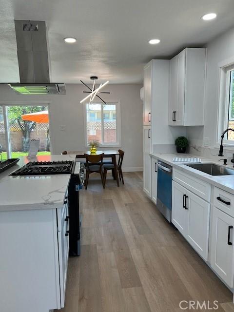 1333 Lancewood Ave, Hacienda Heights, CA 91745 - kitchen featuring dishwashing machine, extractor fan, a sink, stainless steel range with gas stovetop, and white cabinets