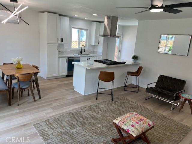 1333 Lancewood Ave, Hacienda Heights, CA 91745 - kitchen with dishwashing machine, exhaust hood, a sink, white cabinetry, and light countertops