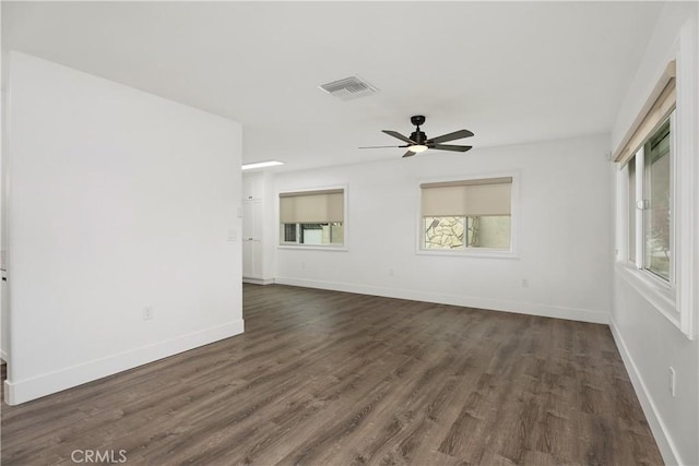 6130 Myrtle Ave, Long Beach, CA 90805 - spare room featuring visible vents, a ceiling fan, dark wood finished floors, and baseboards