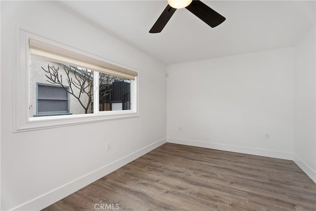 6130 Myrtle Ave, Long Beach, CA 90805 - spare room featuring baseboards, a ceiling fan, and wood finished floors