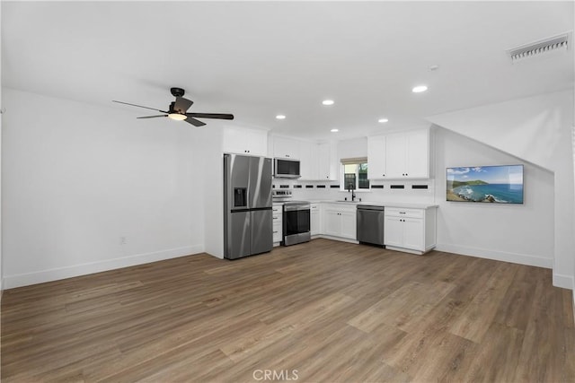 6130 Myrtle Ave, Long Beach, CA 90805 - kitchen featuring light countertops, baseboards, stainless steel appliances, and visible vents
