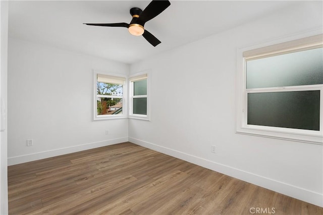 6130 Myrtle Ave, Long Beach, CA 90805 - empty room featuring baseboards, ceiling fan, and wood finished floors