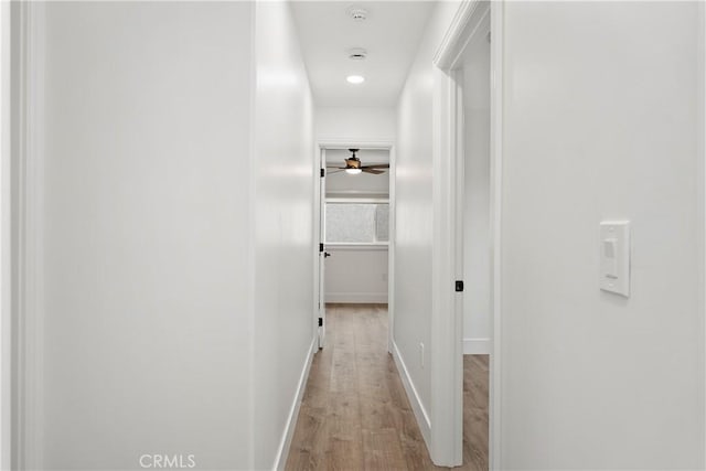 6130 Myrtle Ave, Long Beach, CA 90805 - corridor with baseboards and light wood-type flooring