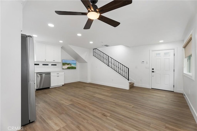 6130 Myrtle Ave, Long Beach, CA 90805 - unfurnished living room with stairs, baseboards, ceiling fan, recessed lighting, and light wood finished floors