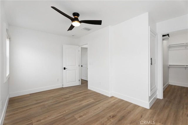 6130 Myrtle Ave, Long Beach, CA 90805 - unfurnished bedroom featuring visible vents, baseboards, and wood finished floors