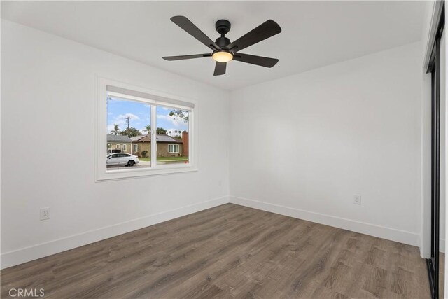 6130 Myrtle Ave, Long Beach, CA 90805 - spare room with baseboards, ceiling fan, and wood finished floors