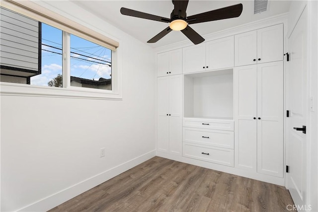 6130 Myrtle Ave, Long Beach, CA 90805 - unfurnished bedroom featuring ceiling fan, light wood-style floors, baseboards, visible vents, and a closet