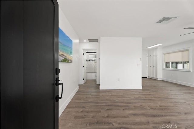 6130 Myrtle Ave, Long Beach, CA 90805 - interior space with visible vents, baseboards, and wood finished floors