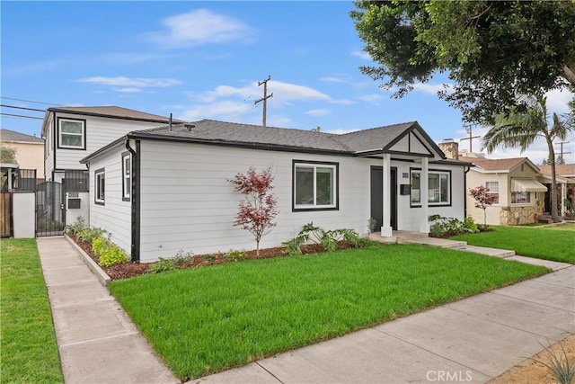 6130 Myrtle Ave, Long Beach, CA 90805 - view of front of property with a gate and a front yard