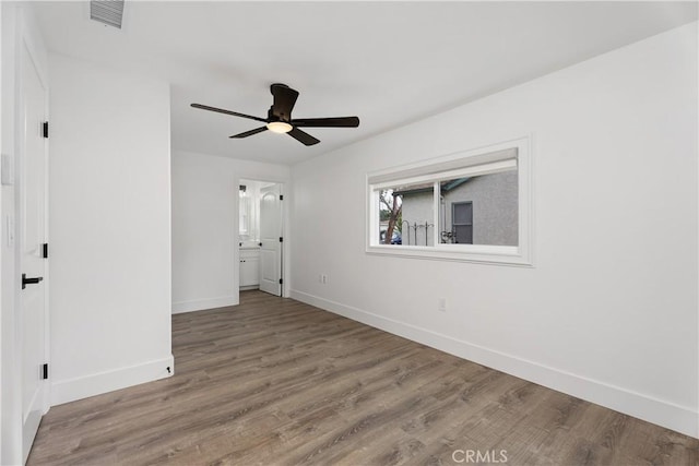 6130 Myrtle Ave, Long Beach, CA 90805 - unfurnished bedroom featuring a ceiling fan, visible vents, wood finished floors, baseboards, and ensuite bath