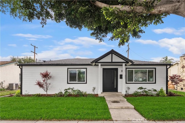 6130 Myrtle Ave, Long Beach, CA 90805 - ranch-style house with central AC unit and a front lawn