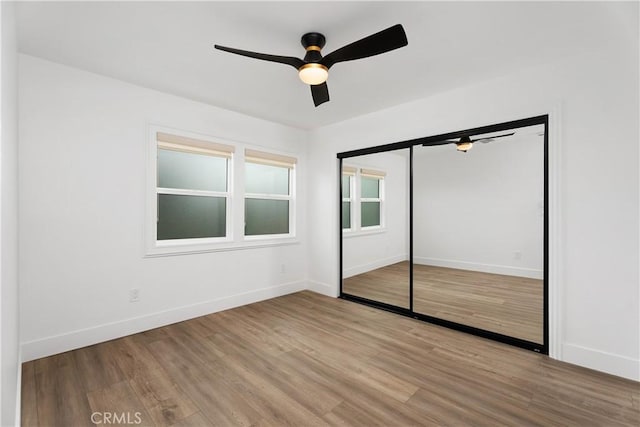 6130 Myrtle Ave, Long Beach, CA 90805 - unfurnished bedroom with baseboards, ceiling fan, wood finished floors, and a closet