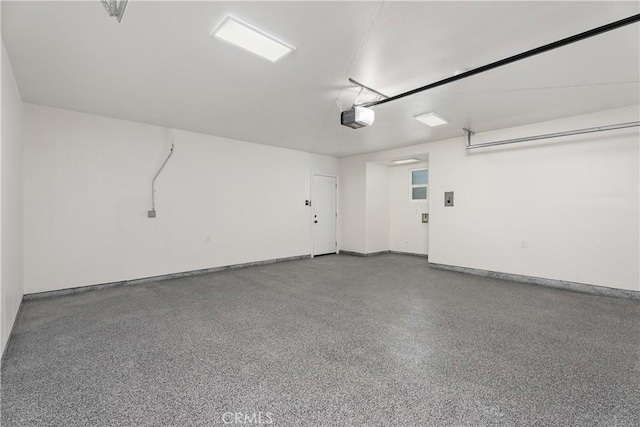 6130 Myrtle Ave, Long Beach, CA 90805 - garage featuring baseboards and a garage door opener