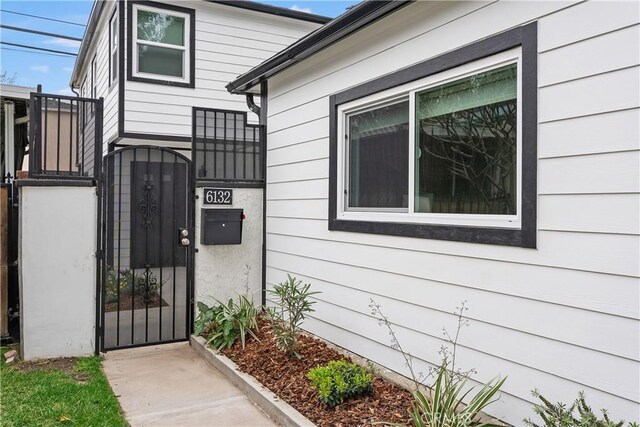 6130 Myrtle Ave, Long Beach, CA 90805 - doorway to property featuring a gate