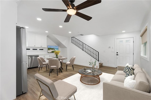 6130 Myrtle Ave, Long Beach, CA 90805 - living area featuring stairway, recessed lighting, ceiling fan, and light wood-type flooring