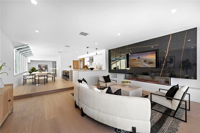 309 Carnation Ave Unit 4, Corona Del Mar, CA 92625 - living room featuring light wood-type flooring and recessed lighting