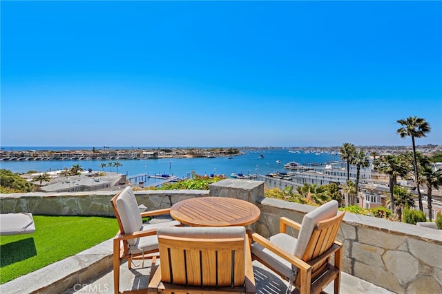 309 Carnation Ave Unit 4, Corona Del Mar, CA 92625 - patio / terrace featuring a water view, view of marina, and outdoor dining space