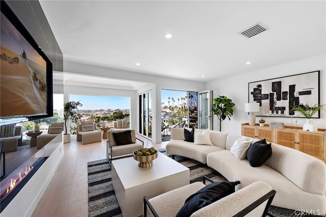 309 Carnation Ave Unit 4, Corona Del Mar, CA 92625 - living area featuring wood finished floors and recessed lighting