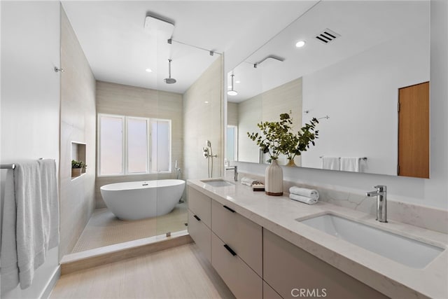 309 Carnation Ave Unit 4, Corona Del Mar, CA 92625 - bathroom featuring double vanity, a freestanding bath, and recessed lighting