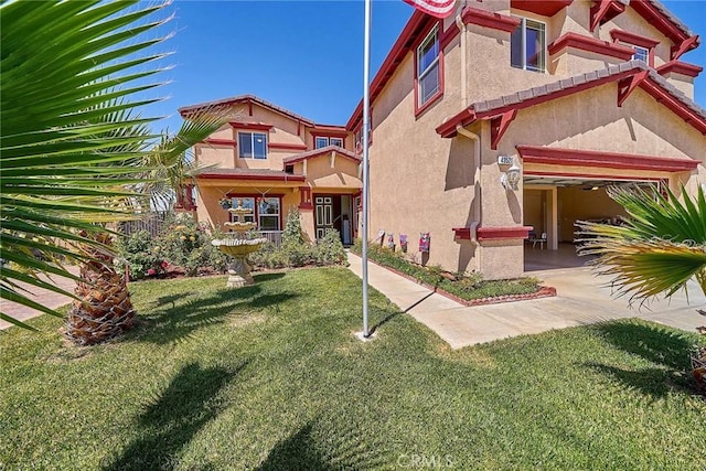 view of front of property featuring stucco siding and a front lawn