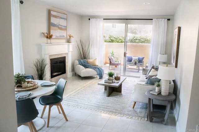 tiled living room with a glass covered fireplace