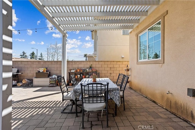 view of patio / terrace featuring a pergola, outdoor dining space, and fence